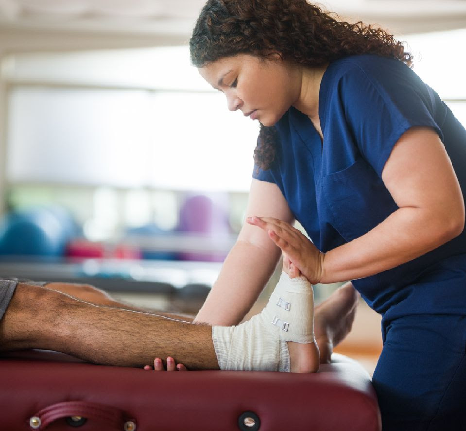 occupational therapist works on ankle