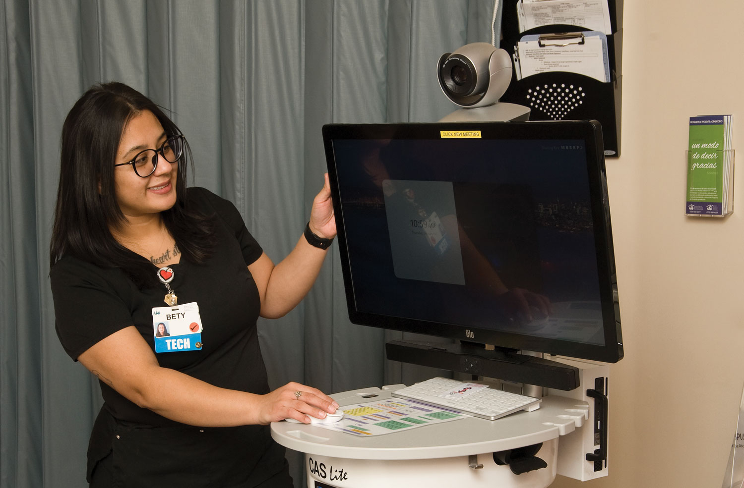 healthcare worker looking at screen in emergency room
