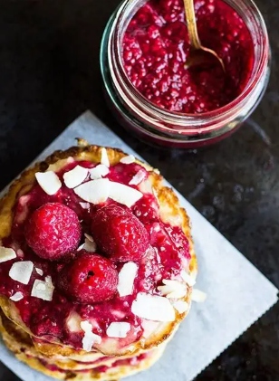 vHigh Protein Cottage Cheese Pancake Pancakes topped with chia jam and raspberries