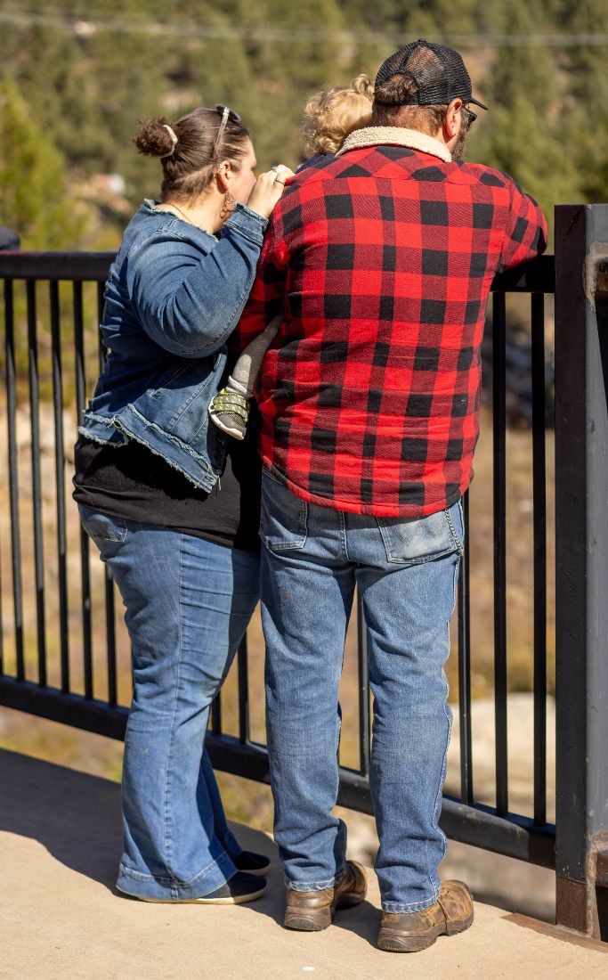 Couple standing together at an overlook railing