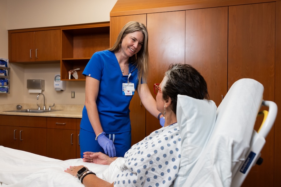 Nurse caring for female patient