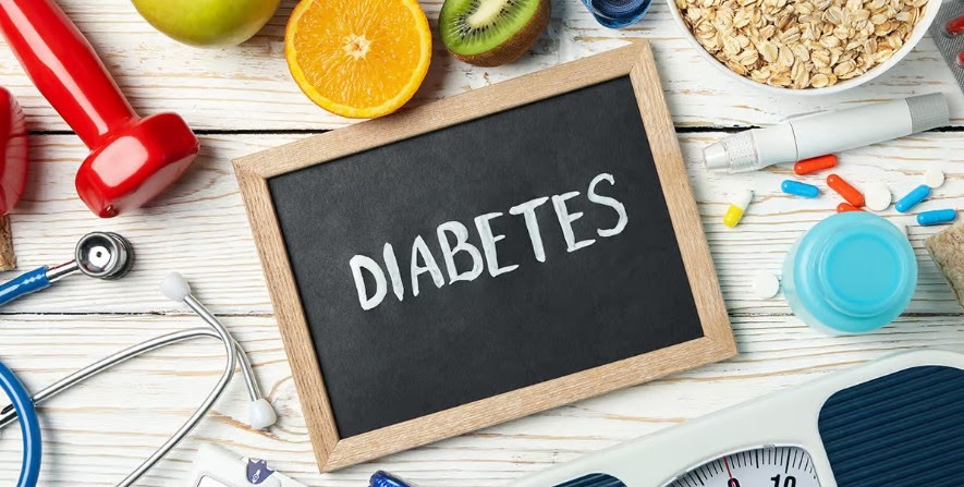 diabetes written on chalkboard surrounded by weight loss tools
