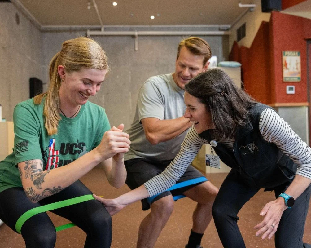 PT gives patients a banded leg exercise